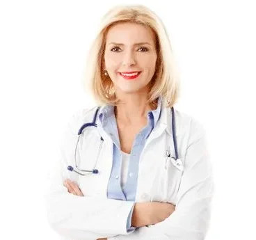 Woman in white medical coat with stethoscope standing with arms crossed